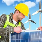 A electrical worker is installing solar panel for business at a site.